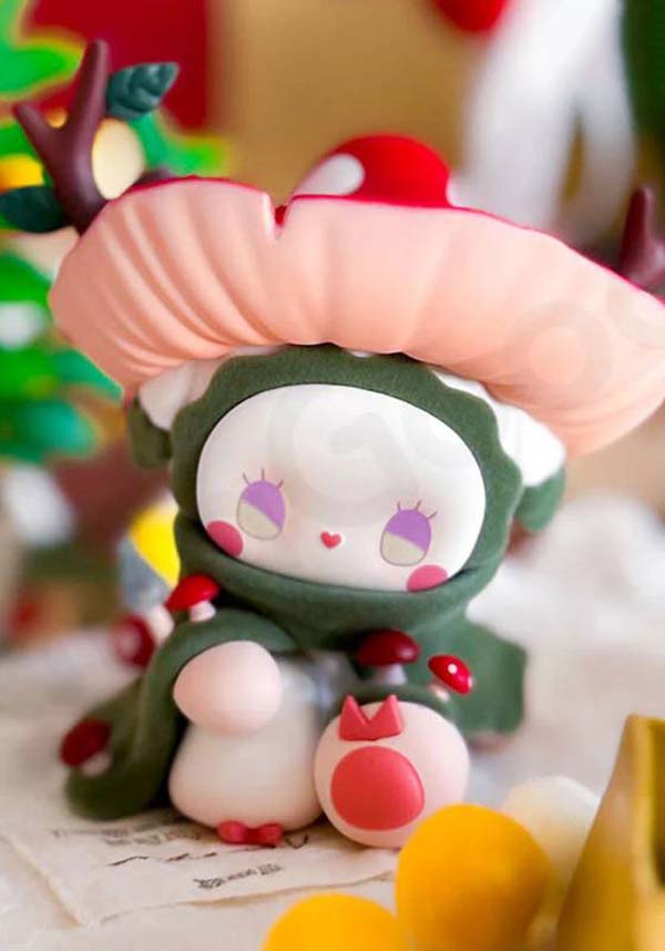 Toy figure with a large mushroom hat against a colorful background