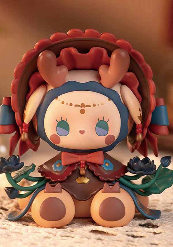 Colorful figurine with a traditional design on a textured surface