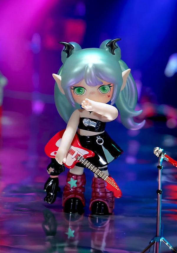 Toy figure with blue hair and red guitar on a reflective surface with colorful background