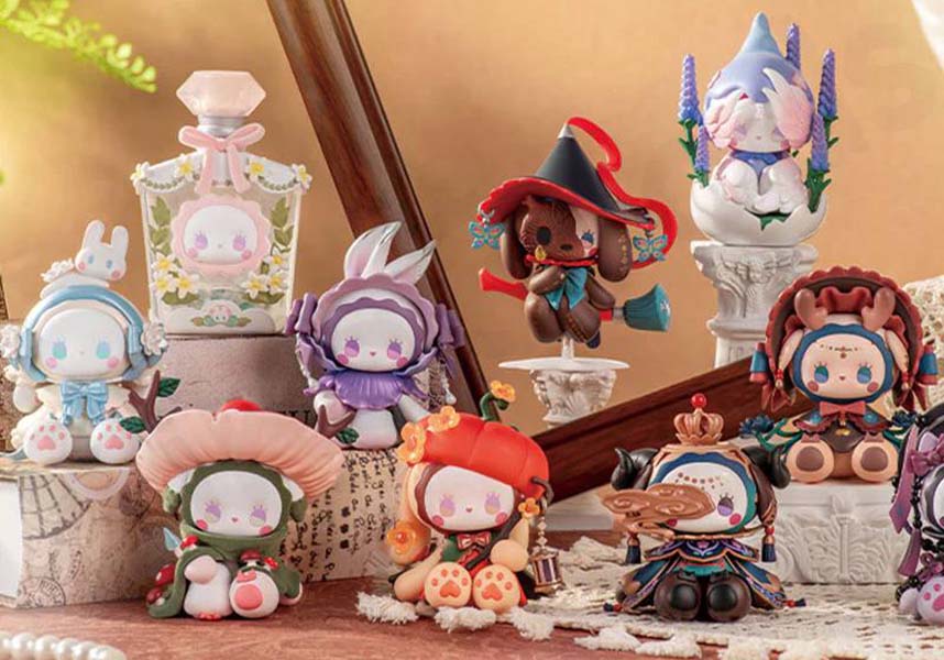 Collection of small figurines on a decorative surface with a warm background