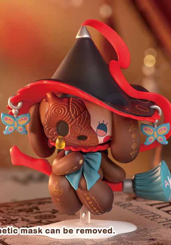 Toy figure with a hat and colorful details on a blurred background