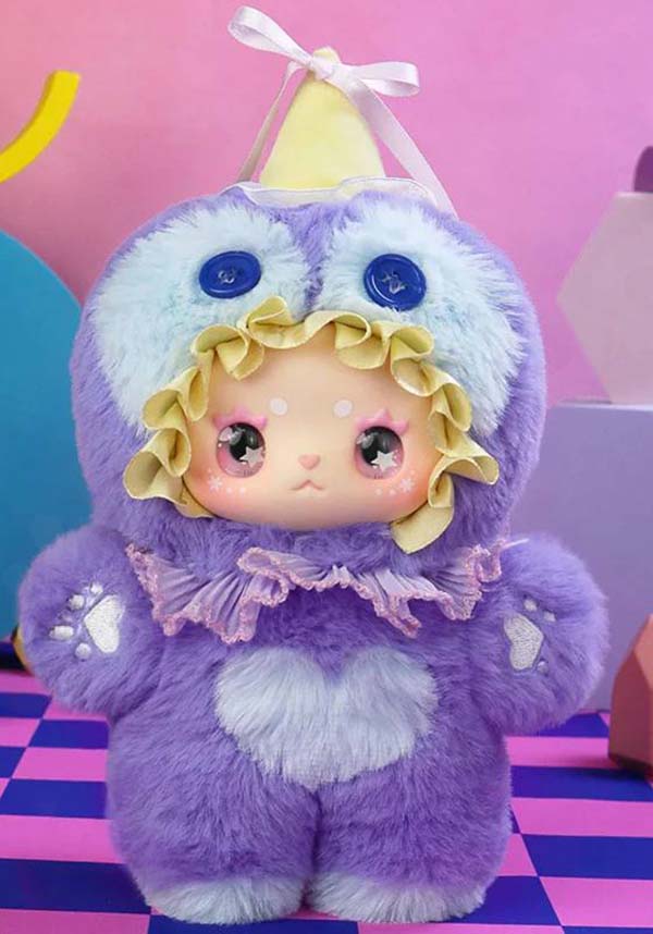 Plush toy with a purple outfit and white heart on a checkered floor with pink and blue background